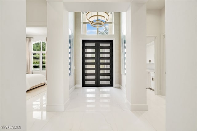 18492 Miromar Lakes Blvd W, Miromar Lakes, FL 33913 - foyer entrance with baseboards and a chandelier