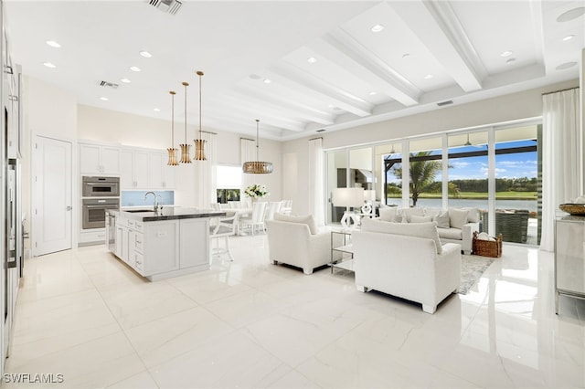 18492 Miromar Lakes Blvd W, Miromar Lakes, FL 33913 - living room featuring beam ceiling and recessed lighting