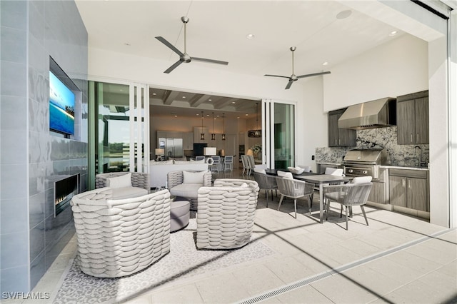 18492 Miromar Lakes Blvd W, Miromar Lakes, FL 33913 - view of patio featuring exterior kitchen, ceiling fan, grilling area, a sink, and outdoor lounge area