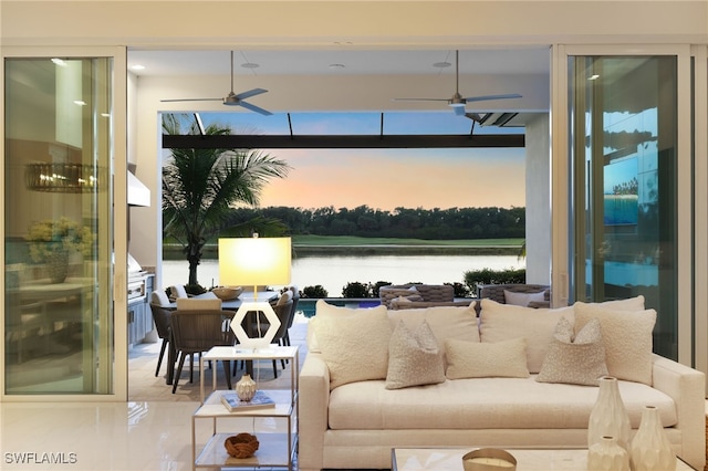 18492 Miromar Lakes Blvd W, Miromar Lakes, FL 33913 - living area with ceiling fan, a water view, and plenty of natural light