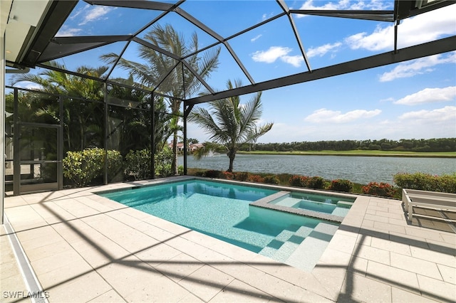 18492 Miromar Lakes Blvd W, Miromar Lakes, FL 33913 - view of pool with a water view, a patio area, glass enclosure, and a pool with connected hot tub
