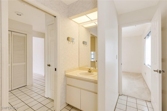 bathroom featuring tile patterned flooring and vanity