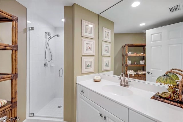 315 Dunes Blvd Unit 307, Naples, FL 34110 - bathroom with a stall shower, vanity, and recessed lighting