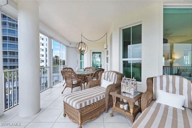 315 Dunes Blvd Unit 307, Naples, FL 34110 - sunroom featuring a chandelier