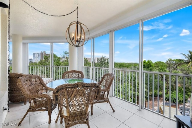 315 Dunes Blvd Unit 307, Naples, FL 34110 - sunroom featuring a chandelier