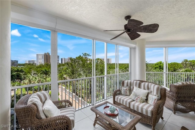 315 Dunes Blvd Unit 307, Naples, FL 34110 - sunroom featuring tile patterned flooring, a ceiling fan, outdoor lounge area, and a textured ceiling