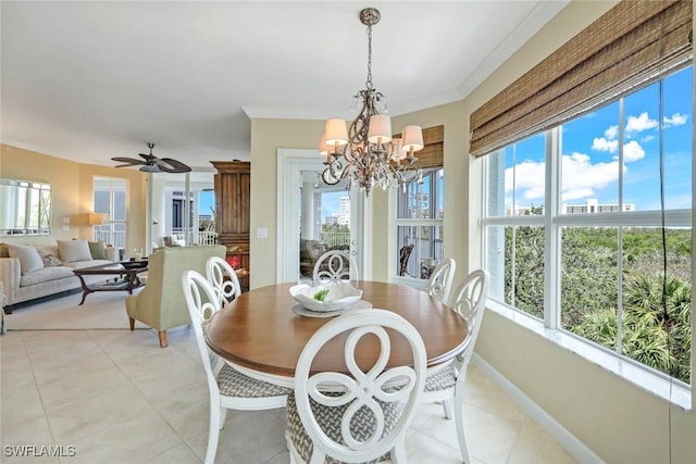 315 Dunes Blvd Unit 307, Naples, FL 34110 - dining space with healthy amount of natural light, a chandelier, ornamental molding, and light tile patterned floors