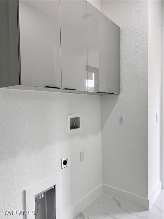laundry area with washer hookup, electric dryer hookup, and baseboards