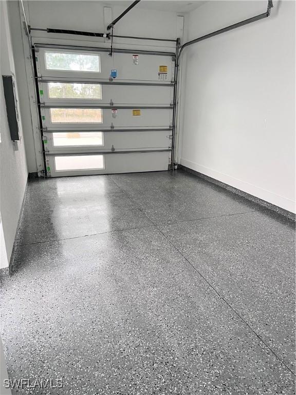 garage featuring baseboards