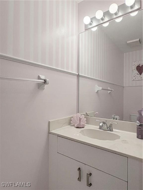 1096 Woodshire Ln Unit C205, Naples, FL 34105 - bathroom featuring vanity and wallpapered walls