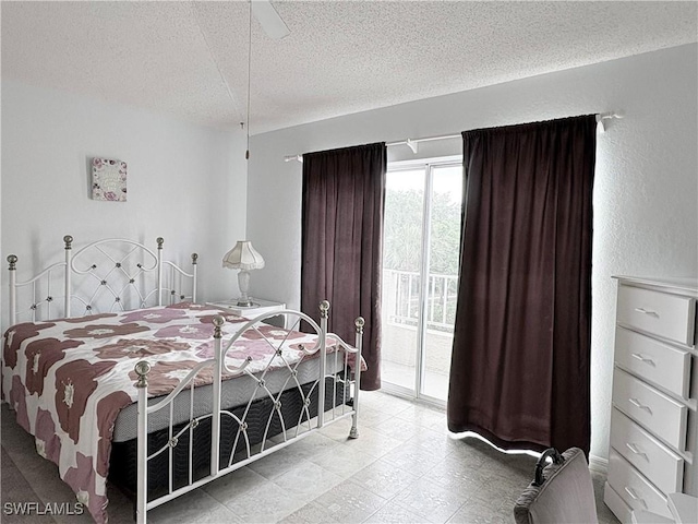 1096 Woodshire Ln Unit C205, Naples, FL 34105 - bedroom with access to outside, a textured ceiling, and a ceiling fan