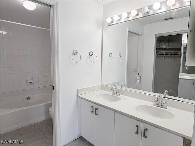 1096 Woodshire Ln Unit C205, Naples, FL 34105 - bathroom with tile patterned floors, double vanity, toilet, and tub / shower combination