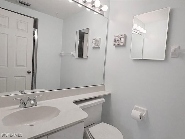 1096 Woodshire Ln Unit C205, Naples, FL 34105 - bathroom featuring toilet and vanity