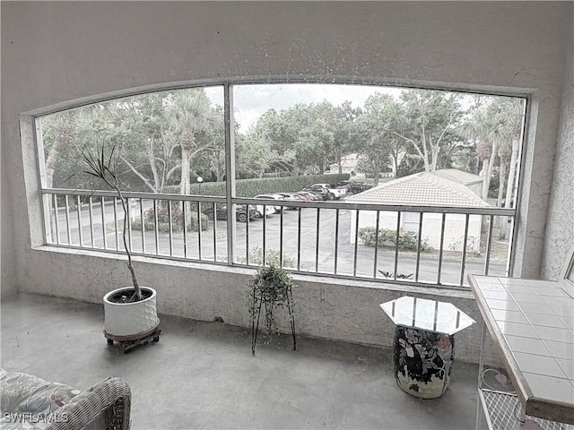 1096 Woodshire Ln Unit C205, Naples, FL 34105 - unfurnished sunroom with healthy amount of natural light
