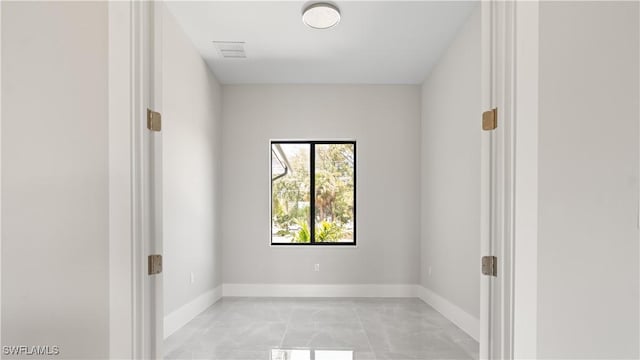 212 Connecticut Rd, Lehigh Acres, FL 33936 - spare room with light marble finish flooring and baseboards