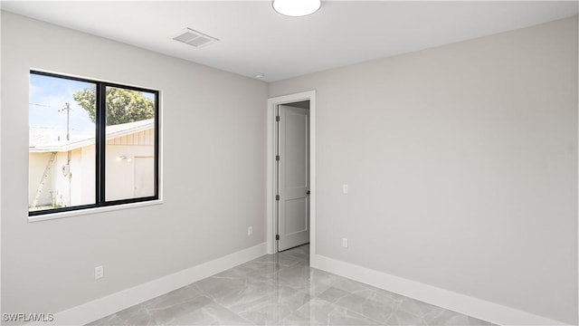 212 Connecticut Rd, Lehigh Acres, FL 33936 - unfurnished room featuring baseboards and light marble finish floors