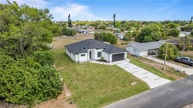 212 Connecticut Rd, Lehigh Acres, FL 33936 - aerial view of property and surrounding area with a tree filled landscape
