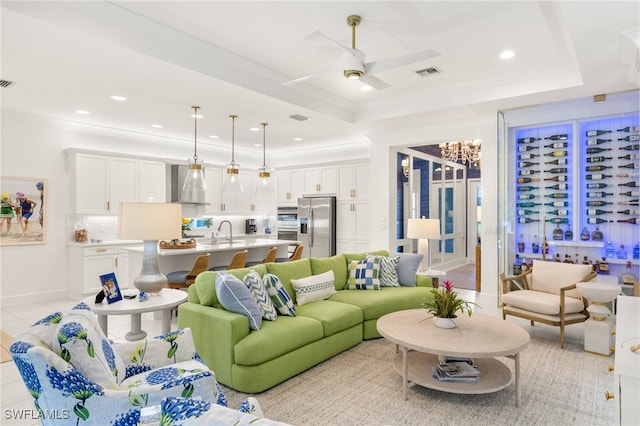 11521 Coronado Way, Naples, FL 34120 - living area featuring a raised ceiling, ceiling fan, recessed lighting, and crown molding