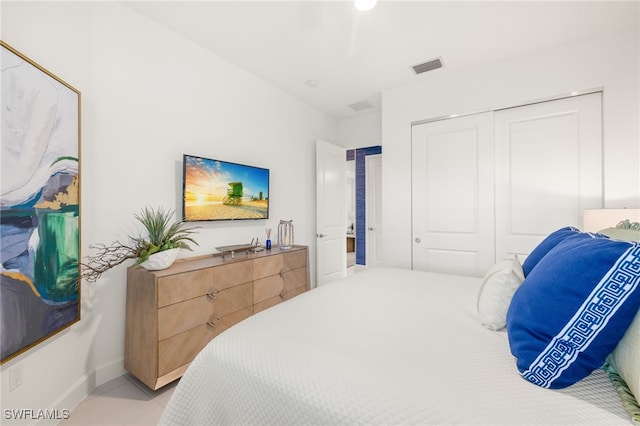 11521 Coronado Way, Naples, FL 34120 - bedroom with a closet, light tile patterned floors, and baseboards