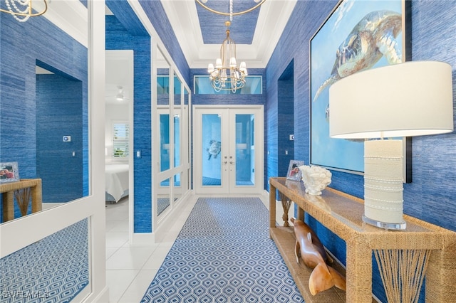 11521 Coronado Way, Naples, FL 34120 - entrance foyer featuring french doors, crown molding, tile patterned floors, a chandelier, and a raised ceiling