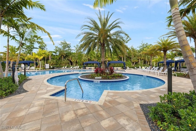 11521 Coronado Way, Naples, FL 34120 - community pool featuring a patio area
