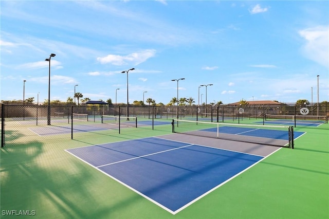 11521 Coronado Way, Naples, FL 34120 - view of tennis court featuring community basketball court and fence