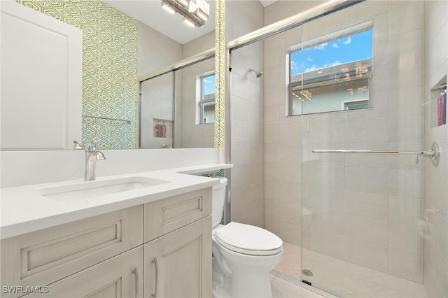 11521 Coronado Way, Naples, FL 34120 - bathroom featuring a shower stall, toilet, healthy amount of natural light, and vanity