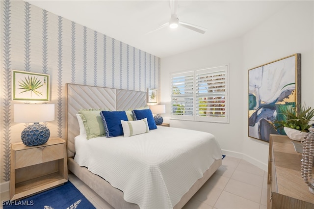 11521 Coronado Way, Naples, FL 34120 - bedroom featuring baseboards, light tile patterned floors, wallpapered walls, and a ceiling fan