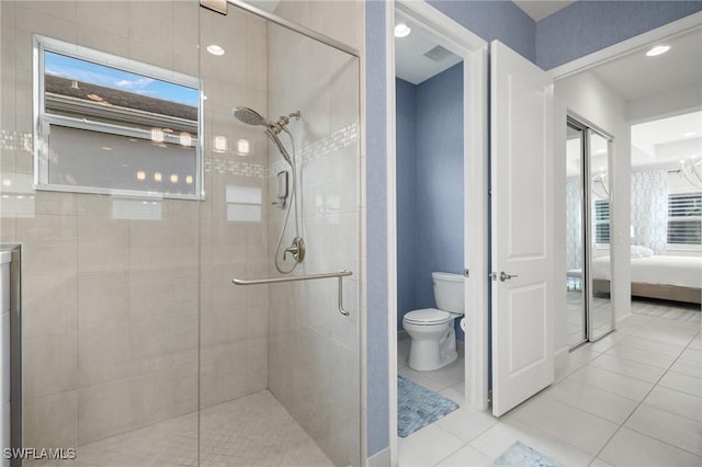 11521 Coronado Way, Naples, FL 34120 - full bathroom featuring toilet, a stall shower, ensuite bathroom, and tile patterned flooring