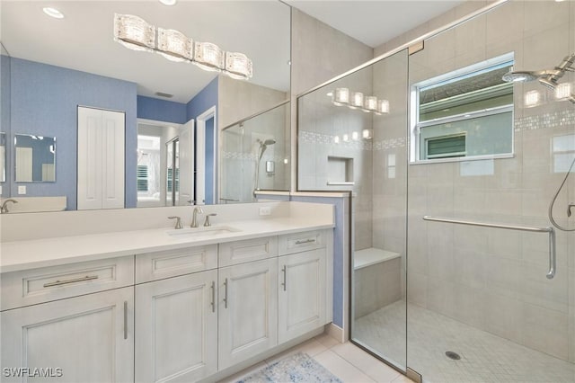 11521 Coronado Way, Naples, FL 34120 - full bathroom with a stall shower, vanity, and tile patterned flooring