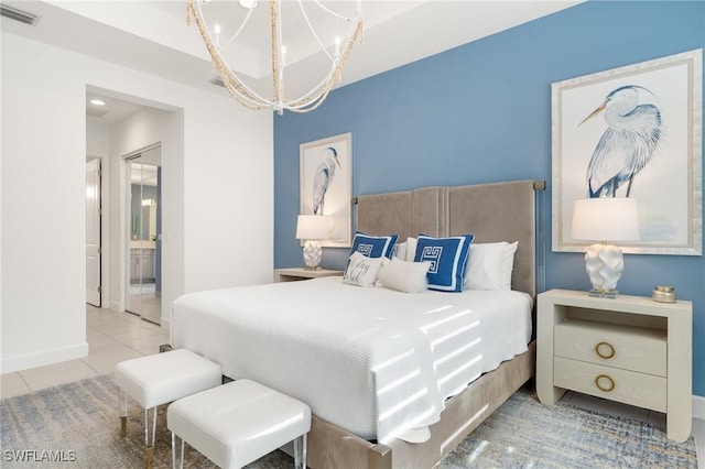 11521 Coronado Way, Naples, FL 34120 - tiled bedroom with a chandelier, baseboards, and ensuite bath