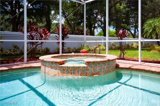 20408 Foxworth Cir, Estero, FL 33928 - view of pool featuring a pool with connected hot tub and a fenced backyard