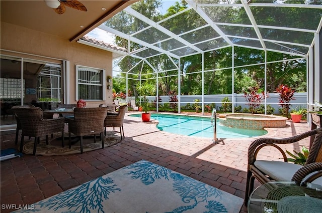 20408 Foxworth Cir, Estero, FL 33928 - view of pool with ceiling fan, a patio area, glass enclosure, and a pool with connected hot tub