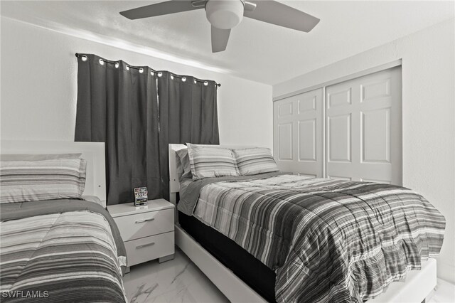 4411 Rose St, Valrico, FL 33596 - bedroom featuring light marble finish floors, a closet, and a ceiling fan