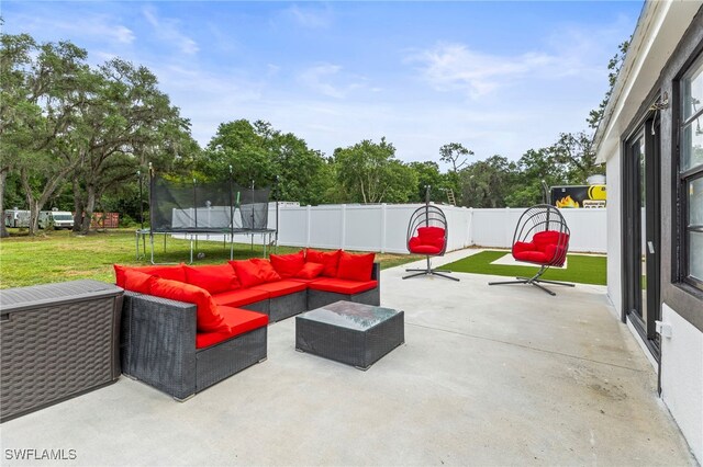4411 Rose St, Valrico, FL 33596 - view of patio with a trampoline and an outdoor living space