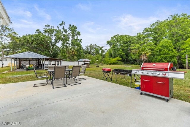 4411 Rose St, Valrico, FL 33596 - view of patio / terrace featuring a gazebo, outdoor dining area, view of scattered trees, and a grill
