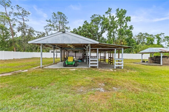 4411 Rose St, Valrico, FL 33596 - view of vehicle parking with an exterior structure and a detached carport