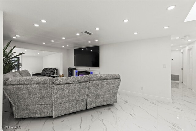 4411 Rose St, Valrico, FL 33596 - living room with recessed lighting, baseboards, and light marble finish floors