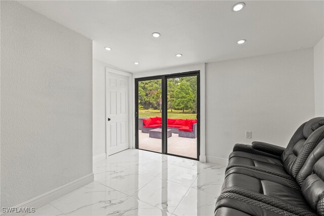 4411 Rose St, Valrico, FL 33596 - living room with light marble finish floors, baseboards, and recessed lighting