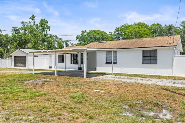 4411 Rose St, Valrico, FL 33596 - view of front facade with a patio and an attached carport