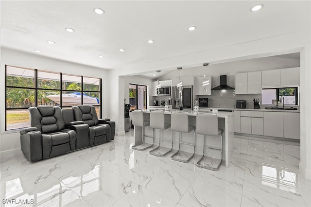 4411 Rose St, Valrico, FL 33596 - living room with recessed lighting, baseboards, and light marble finish flooring