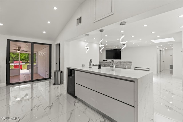 4411 Rose St, Valrico, FL 33596 - kitchen featuring light marble finish flooring, white cabinetry, recessed lighting, modern cabinets, and open floor plan