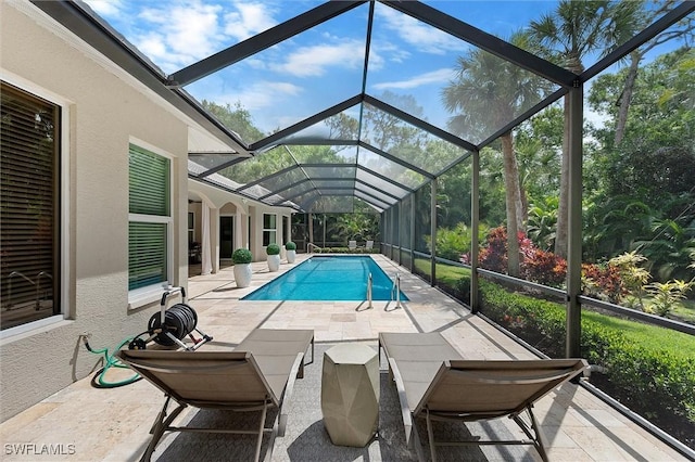 2026 Merlin Ct, Naples, FL 34105 - swimming pool featuring a patio area and glass enclosure