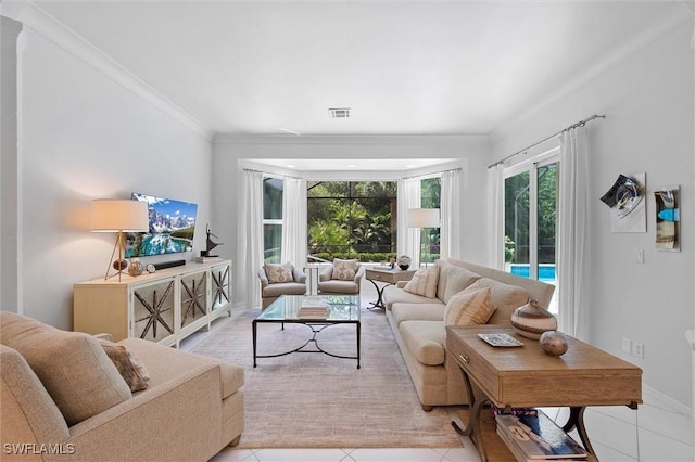 2026 Merlin Ct, Naples, FL 34105 - living room featuring light tile patterned flooring, plenty of natural light, and ornamental molding
