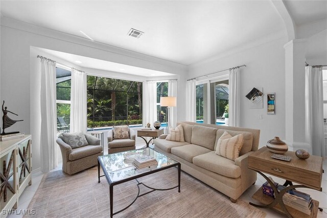 2026 Merlin Ct, Naples, FL 34105 - living room with plenty of natural light and arched walkways