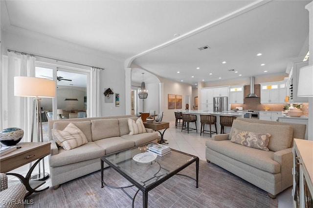 2026 Merlin Ct, Naples, FL 34105 - living room with a chandelier, light tile patterned floors, arched walkways, and recessed lighting