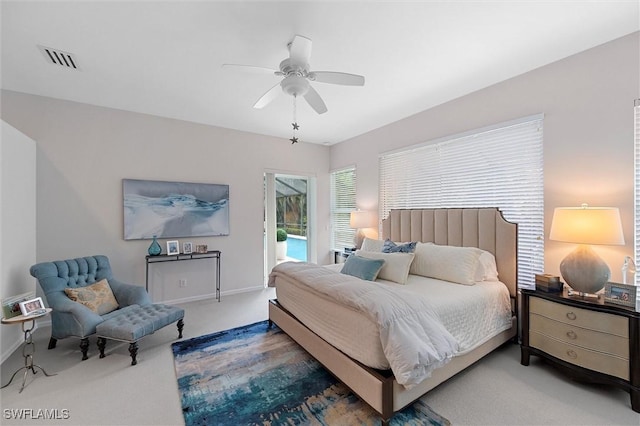 2026 Merlin Ct, Naples, FL 34105 - carpeted bedroom featuring access to outside, a ceiling fan, and baseboards