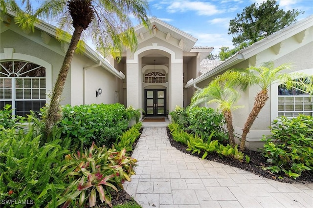 2026 Merlin Ct, Naples, FL 34105 - entrance to property with french doors and stucco siding