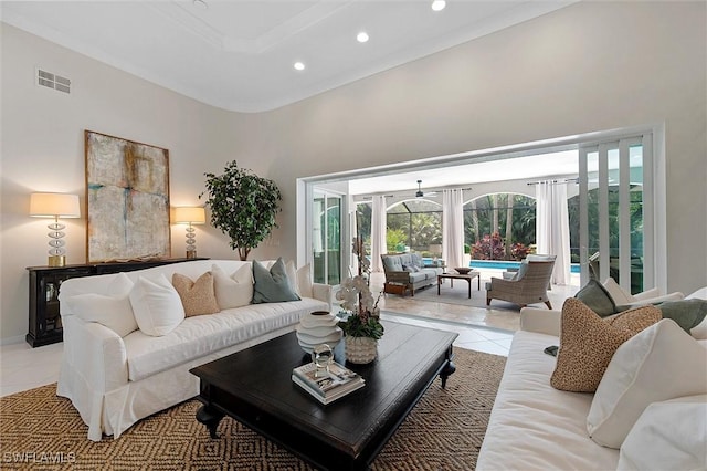 2026 Merlin Ct, Naples, FL 34105 - living area featuring light tile patterned floors, plenty of natural light, a towering ceiling, recessed lighting, and french doors
