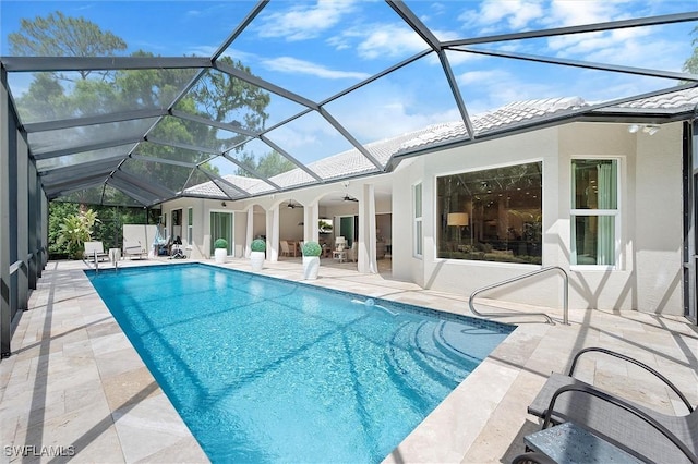 2026 Merlin Ct, Naples, FL 34105 - outdoor pool featuring a patio, a ceiling fan, and glass enclosure